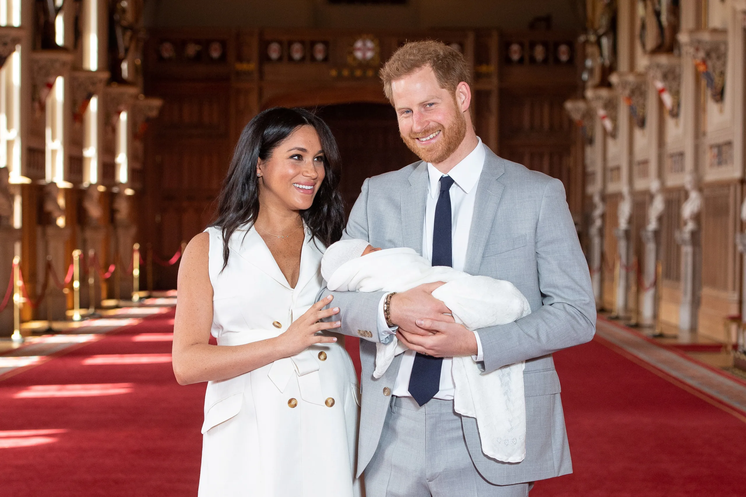 Britain’s Prince Harry and Meghan, Duchess of Sussex are seen with their baby son, who was born on Monday morning, during a photocall in St George’s Hall at Windsor Castle, in Berkshire, Britain May 8, 2019. Dominic Lipinski/Pool via REUTERS