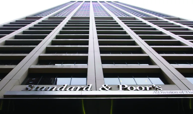 The Standard and Poor’s sign hangs from their building headquarters in New York on Friday, Mar. 6, 2009. Photographer: Jin Lee/Bloomberg News