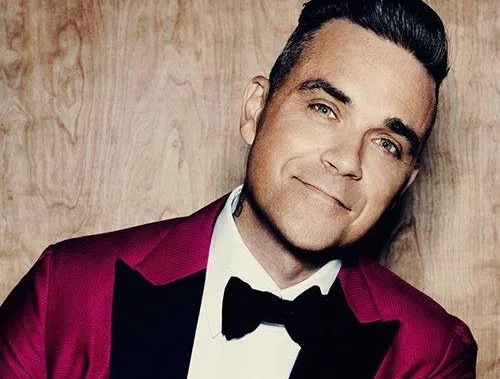 Robbie Williams posta foto nu para divulgar biografia