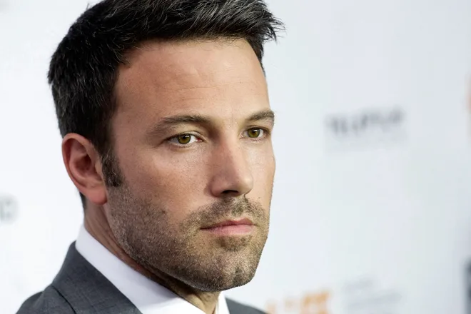 Actor and director Ben Affleck poses for a photograph on the red carpet at the gala for the new movie “Argo” during the 37th annual Toronto International Film Festival in Toronto on Friday, Sept. 7, 2012. (AP Photo/The Canadian Press, Nathan Denette)