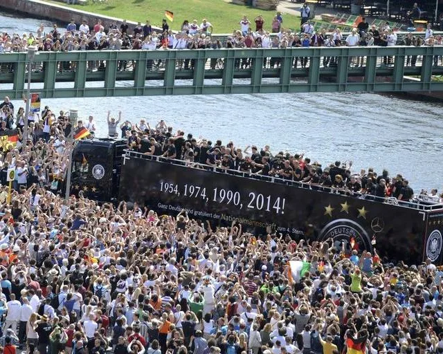 Fans throng a street along the river Spree in central Berlin to cheer Germany’s 2014 Brazil World Cup squad as they proceed in an open-top bus through the capital during a parade to mark the team’s victory July 15, 2014. Germany’s victorious soccer team led by coach Joachim Loew returned home on Tuesday after winning […]