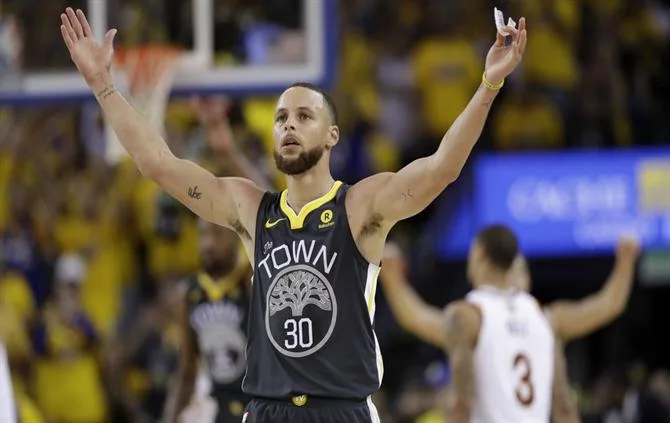 Golden State Warriors guard Stephen Curry (30) celebrates during the second half of Game 2 of basketball’s NBA Finals between the Warriors and the Cleveland Cavaliers in Oakland, Calif., Sunday, June 3, 2018. (AP Photo/Marcio Jose Sanchez) NBA Finals Cavaliers Warriors Basketball