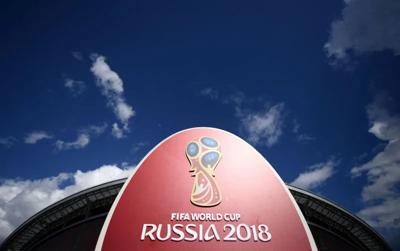 The 2018 World Cup logo is pictured outside the Kazan Arena stadium in Kazan, Russia, on June 17, 2017 ahead of the Russia 2017 Confederation Cup football tournament. / AFP / FRANCK FIFE