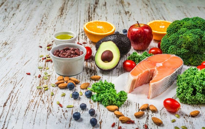 Selection of fresh fruit and vegetables, salmon, beans, and nuts. Concept of cooking and eating healthy food, fitness, dieting, vegetarian, and lifestyle. Ingredients good for heart and diabetes.