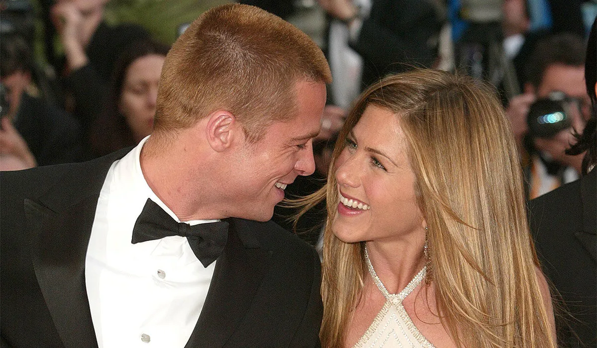 CANNES, FRANCE – MAY 13: Actor Brad Pitt and wife actress Jennifer Aniston attend the World Premiere of the epic movie “Troy” at Le Palais de Festival on May 13, 2004 in Cannes, France. Aniston wears a dress by Versace. (Photo by Evan Agostini/Getty Images)