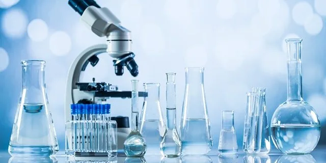 Science laboratory research and development concept. microscope with test tubes