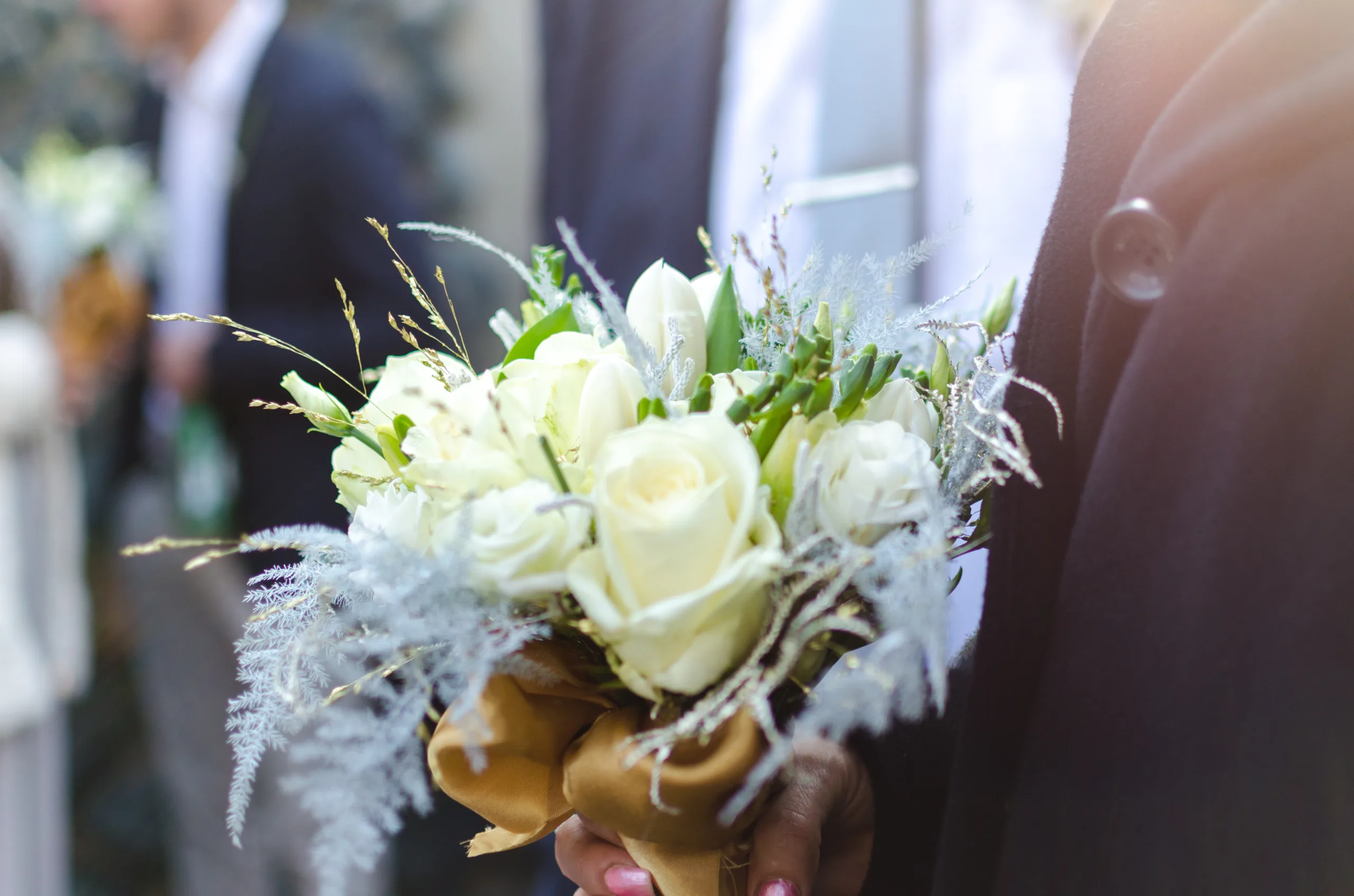 Man holding flower on wedding day