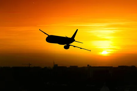 Beautiful sunset with airplane