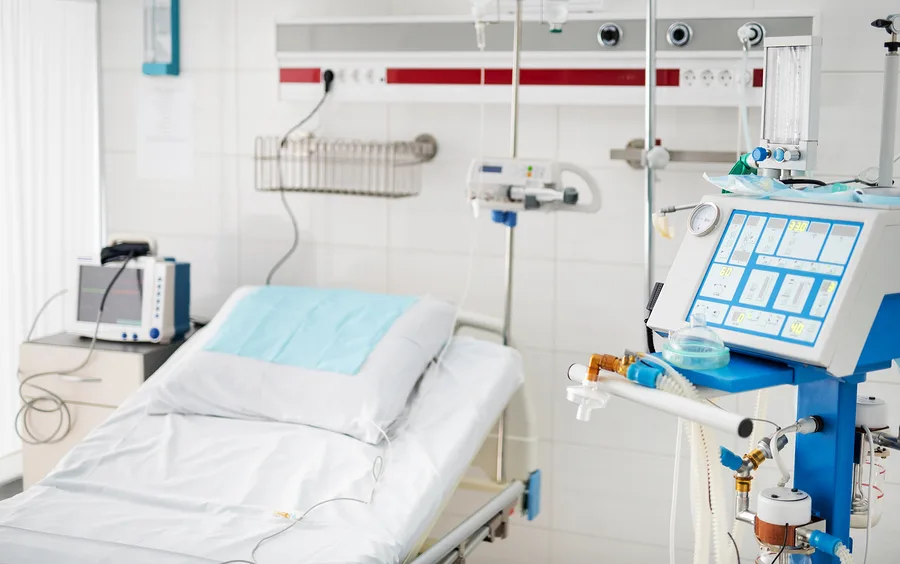 Modern hospital room with bed and ventilation equipment