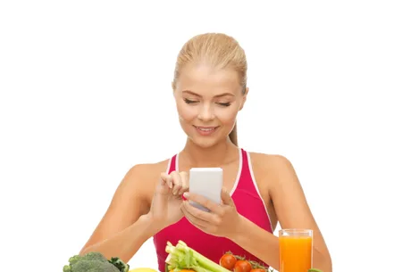 woman with fruits, vegetables and smartphone