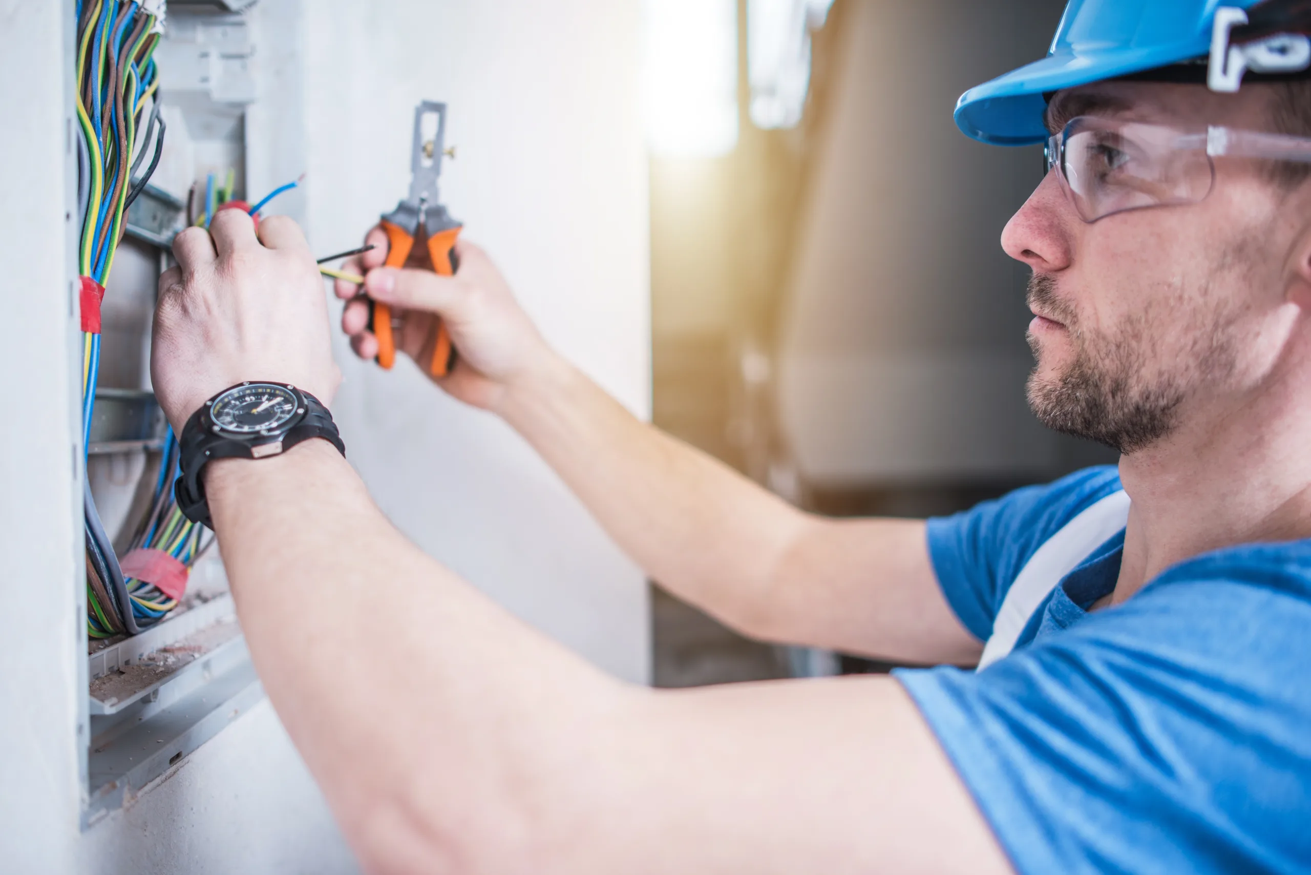 Electric Technician Job. Caucasian Professional Electrician in His 30s Finishing Electric Box Inside the Apartment.