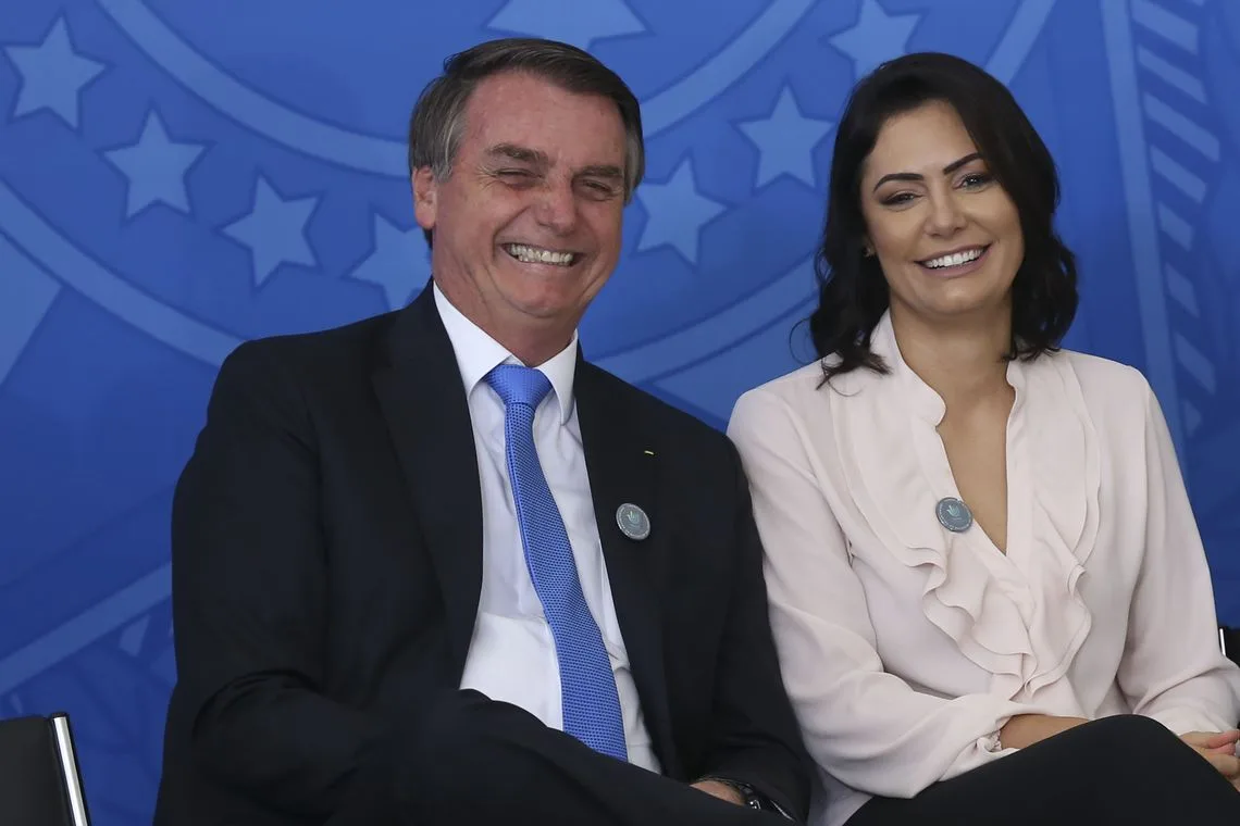 O presidente Jair Bolsonaro,e a primeira-dama, Michelle Bolsonaro, durante a cerimônia de comemoração ao Dia Nacional do Voluntariado.