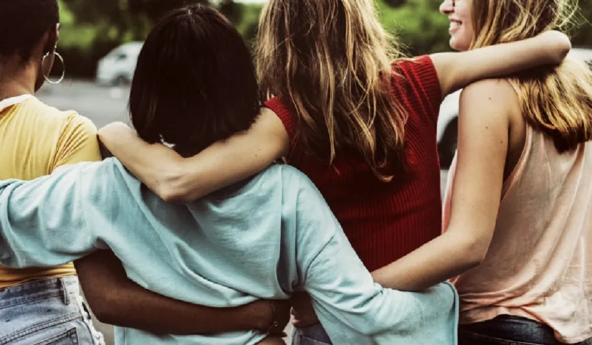 Rear view of a group of diverse woman friends walking together