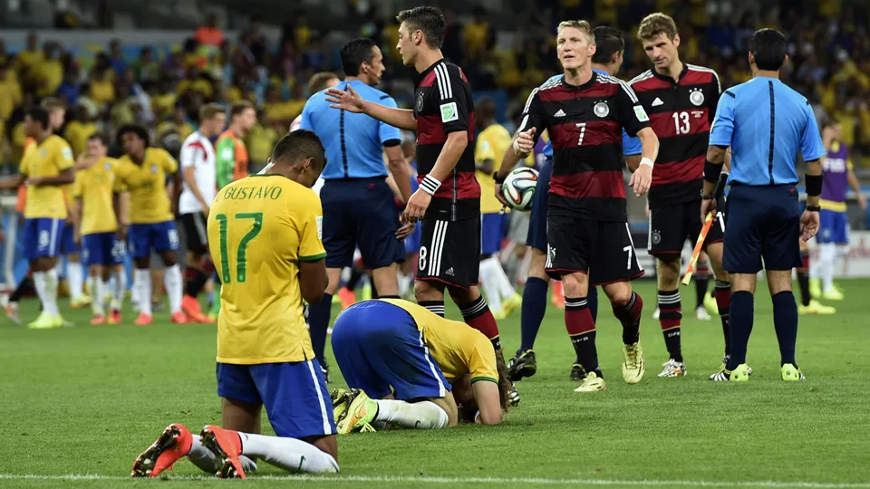 Brazil players sink to their knees after the World Cup semifinal soccer match between Brazil and Germany at the Mineirao Stadium in Belo Horizonte, Brazil, Tuesday, July 8, 2014. Germany won the match 7-1. (AP Photo/Martin Meissner)