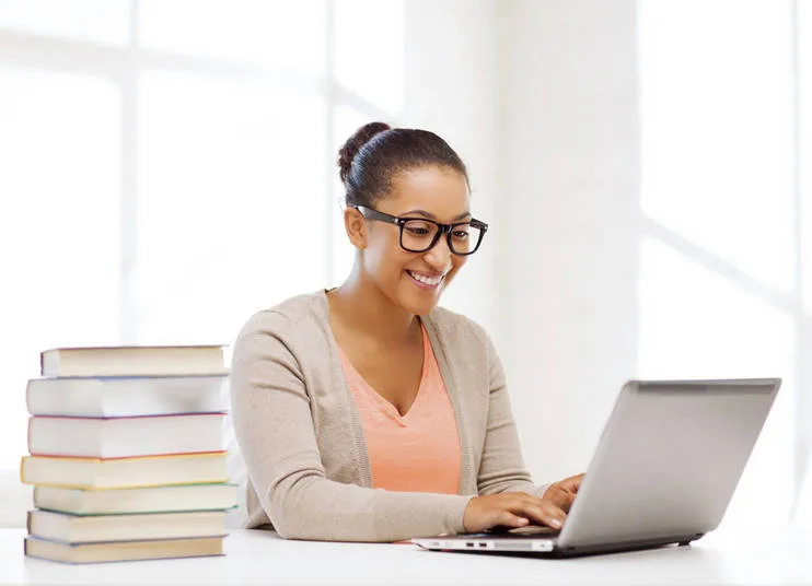 international student girl with laptop at school