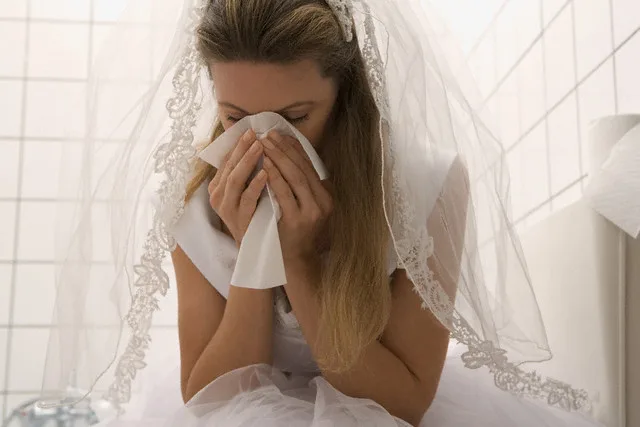 Woman in Wedding Dress Crying in Bathroom — Image by © Ursula Klawitter/Corbis