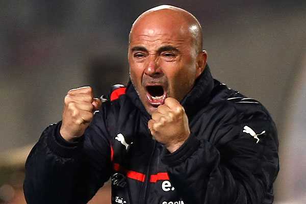 Chile’s head coach Jorge Sampaoli celebrates a goal by his team during a 2014 World Cup qualifying soccer match against Bolivia in Santiago June 11, 2013. REUTERS/Ivan Alvarado (CHILE – Tags: SPORT SOCCER)