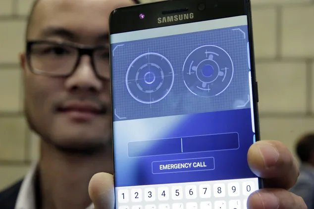 In this July 28, 2016, photo, Jonathan Wong of Samsung’s Knox Product Marketing, shows the iris scanner feature of the Galaxy Note 7, in New York. Samsung releases an update to its jumbo smartphone and virtual-reality headset, mostly with enhancements rather than anything revolutionary during a preview of Samsung products. (AP Photo/Richard Drew)