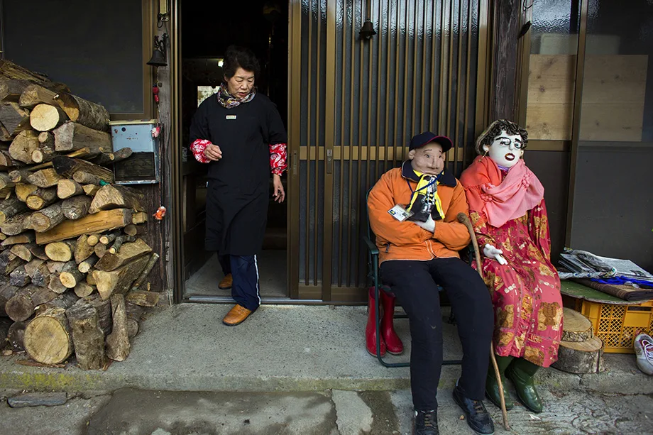 Tsukimi Ayano steps out of her house in the village of Nagoro, Feb. 24, 2015.