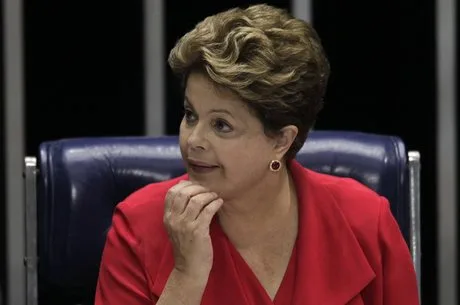 Brazil’s President Dilma Rousseff participates in a solemn session for the final report of the Parliamentary Inquiry Committee on Violence against Women presentation, at the National Congress in Brasilia August 27, 2013. REUTERS/Ueslei Marcelino (BRAZIL – Tags: POLITICS)