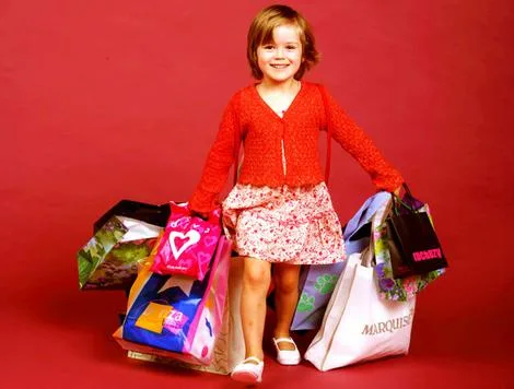 Toddler with shopping bags.