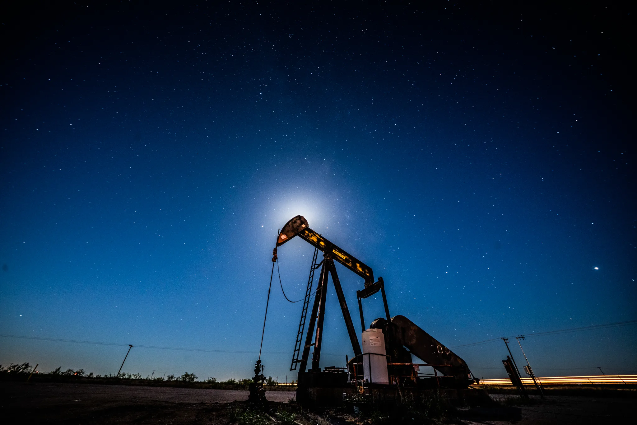 MIDLAND, TX – MAY 5: Workers extracting oil from oil wells in the Permian Basin in Midland, Texas on May 5, 2018. Oil production has been causing a sudden influx of money especially for local Texans despite the consequences to the natural environment. (Photo by Benjamin Lowy/Getty Images)