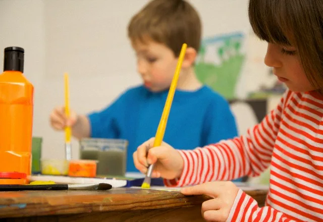 UK — Portrait of a boy and young girl painting — Image by © Jutta Klee/ableimages/Corbis