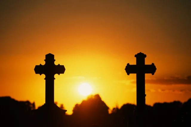 Germany — Crucifixes, tombstones at sunset, Lemgow, Wendland, Lower Saxony, Germany / crucifix — Image by © Damschen, D./Corbis