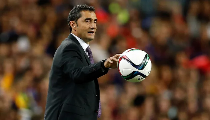 Athletic Bilbao’s head coach Ernesto Valverde holds the ball during a second leg Spanish Super Cup soccer match between FC Barcelona and Athletic Bilbao at the Camp Nou stadium in Barcelona, Spain, Monday, Aug.17, 2015. (AP Photo/Manu Fernandez)