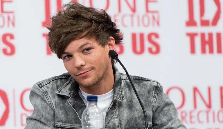 LONDON, ENGLAND – AUGUST 19: Louis Tomlinson attends a press conference for “One Direction This Is Us” at Big Sky Studios on August 19, 2013 in London, England. (Photo by Ian Gavan/Getty Images for Sony Pictures)