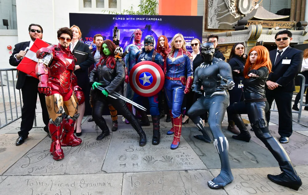 Fans of the Avengers strike a pose while dressed in costumes for a costume contest before the first screening of “Avengers: Endgame” at the TCL Chinese Theater in Hollywood, California on April 25, 2019. (Photo by Frederic J. BROWN / AFP)