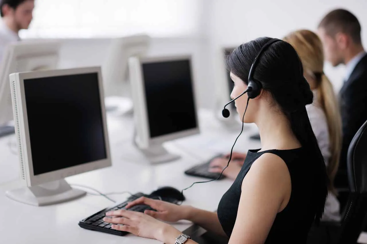 business people group with headphones giving support in help desk office to customers, manager giving training and education instructions