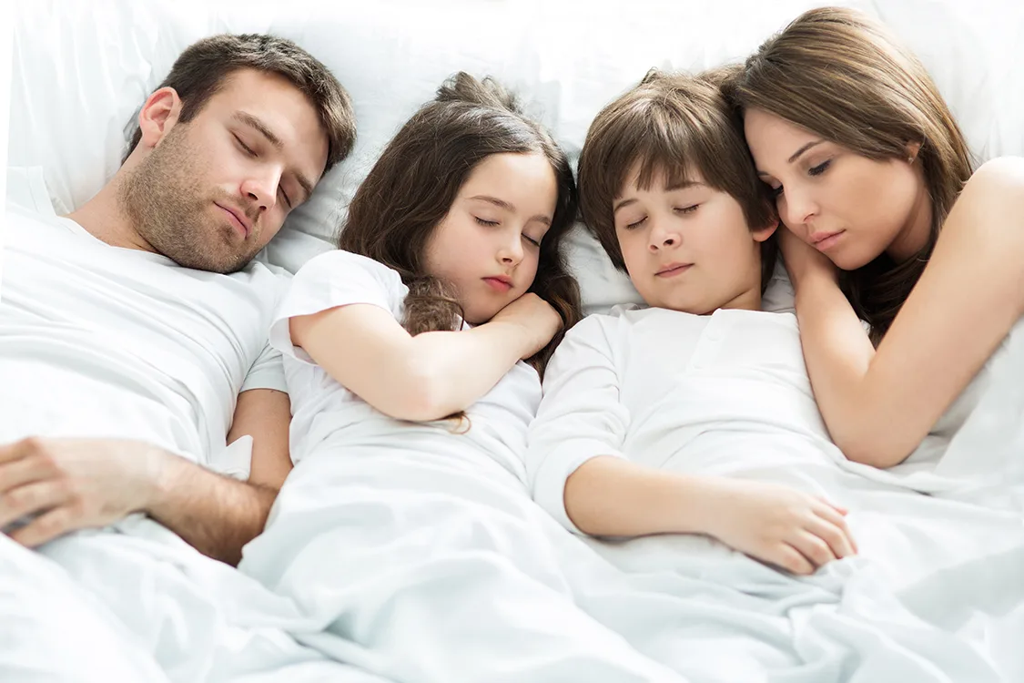 Family of four sleeping