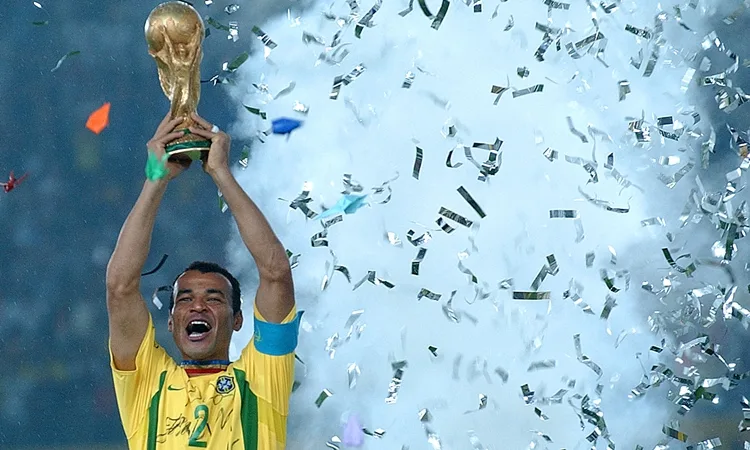 Brazil’s captain Cafu holds the trophy after the 2002 World Cup final soccer match between Brazil and Germany Sunday, June 30, 2002 in Yokohama, Japan. Brazil won the match 2-0. (AP Photo/Luca Bruno)