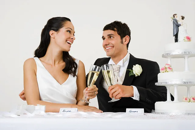 Bride and groom toasting with champagne — Image by © Image Source/Corbis