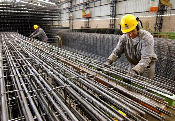 workers build columns of steel made for construction at Gerdau steel plant in Sao Jose dos Campos , State of Sao Paulo, Brazil