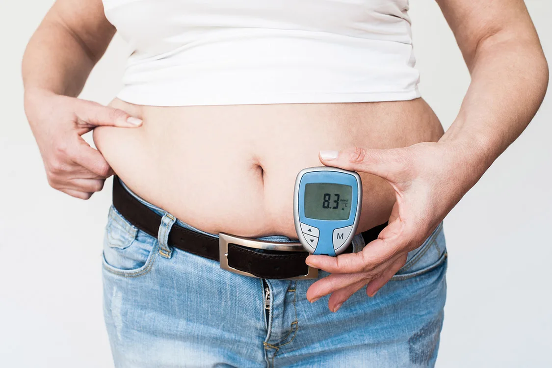 Overweight Woman Showing Her Glucose Level Test