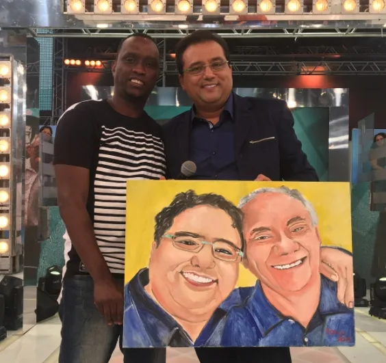 Geraldo Luís ganha quadro com pintura de foto sua com Marcelo Rezende