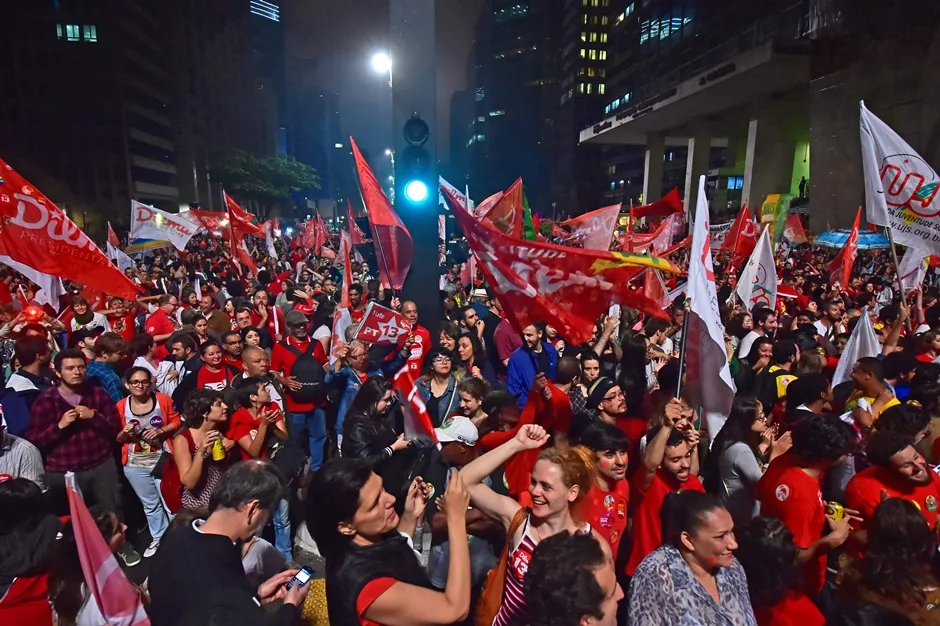 Supporters celebrate the reelection of the Brazilian President and presidential candidate for the Workers’ Party (PT) Dilma Rousseff in the presidential election run-off along Paulista Avenue in Sao Paulo Brazil on October 26 2014. President Dilma Rousseff, a former leftist guerrilla once imprisoned and tortured by Brazil’s military regime, upheld her reputation for toughness in […]