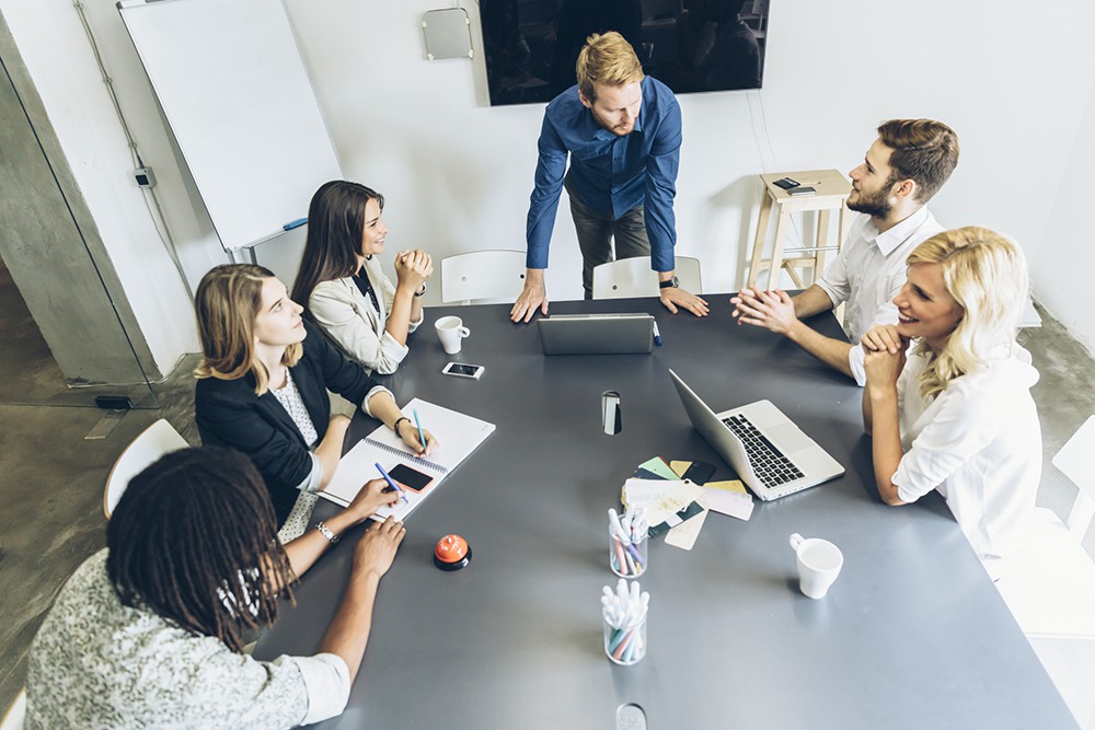 Office brainstorming, people sitting at desk