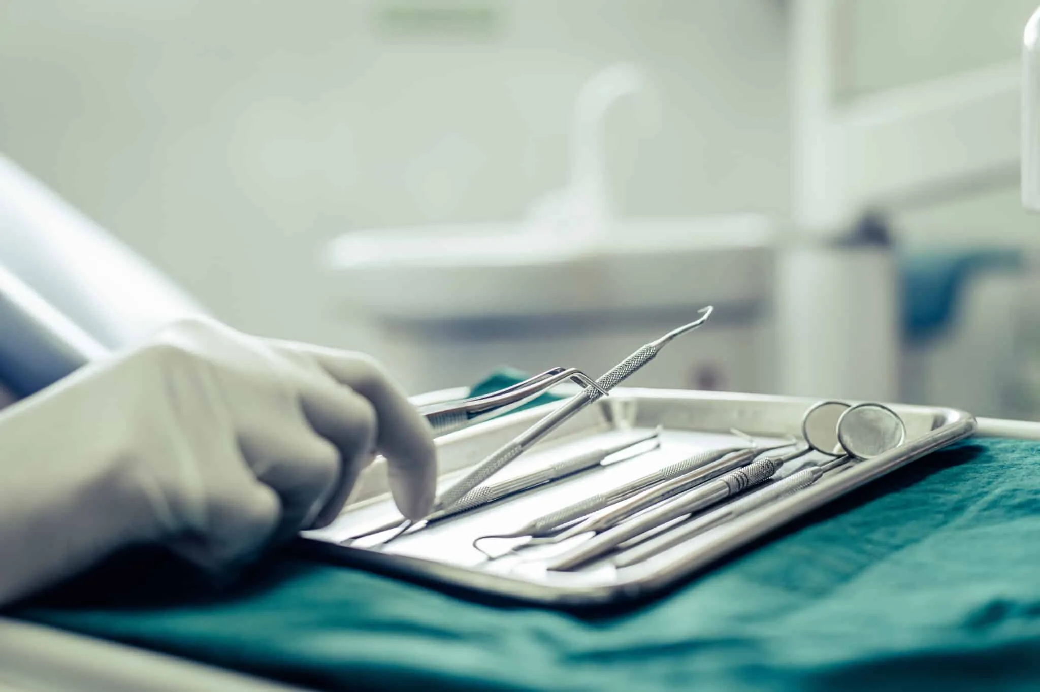 Dentists choose equipment on the table.