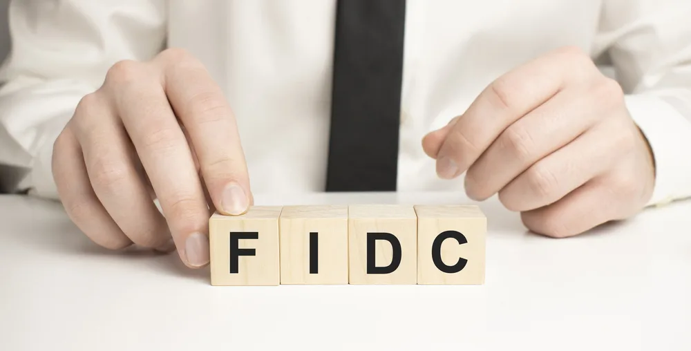 Man made word fdic with wood blocks