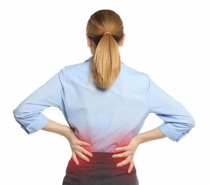 Woman suffering from back pain on white background