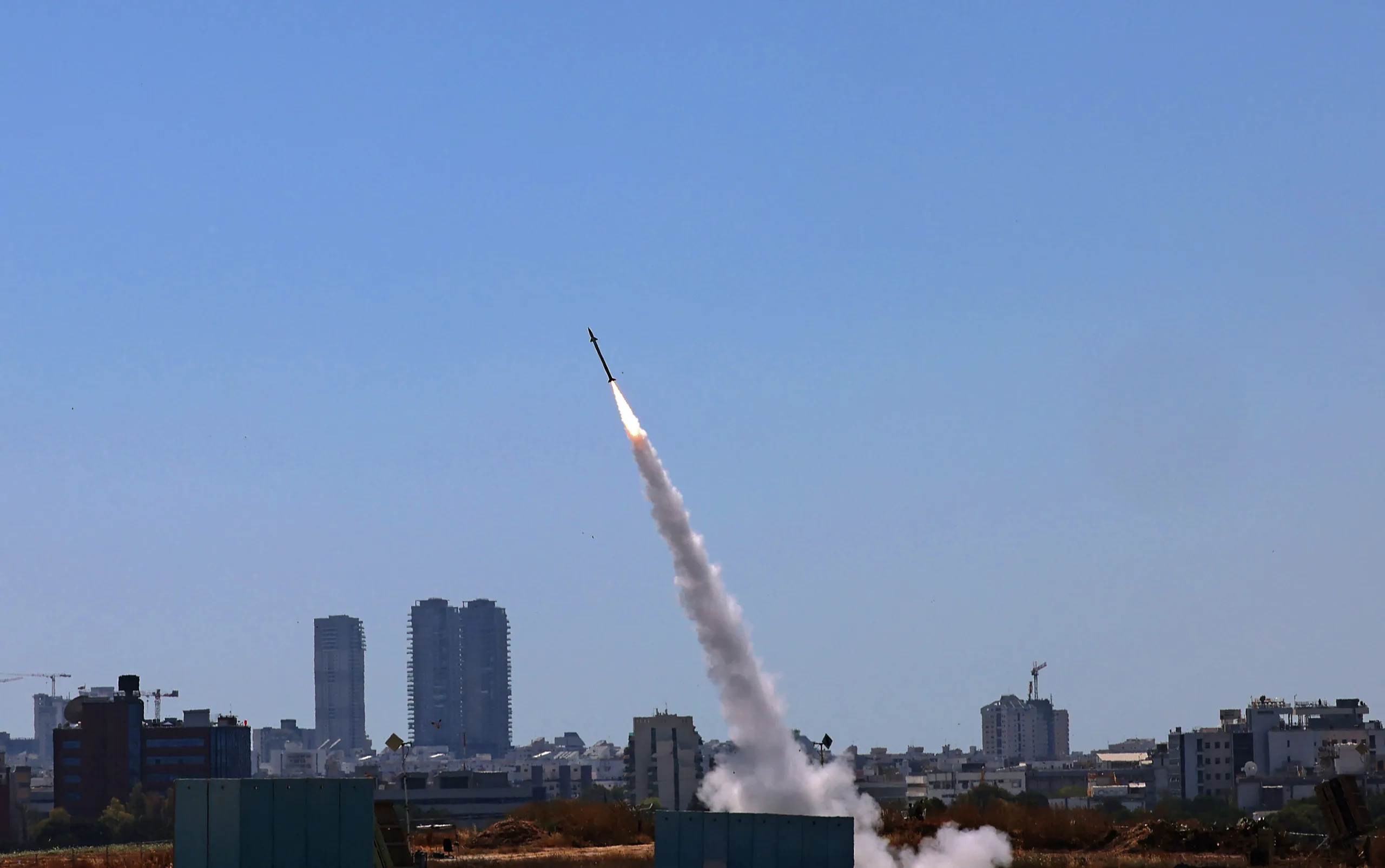 Israel’s Iron Dome aerial defence system is activated to intercept a rocket launched from the Gaza Strip, controlled by the Palestinian Hamas movement, above the southern Israeli city of Ashdod, on May 12, 2021. (Photo by EMMANUEL DUNAND / AFP)