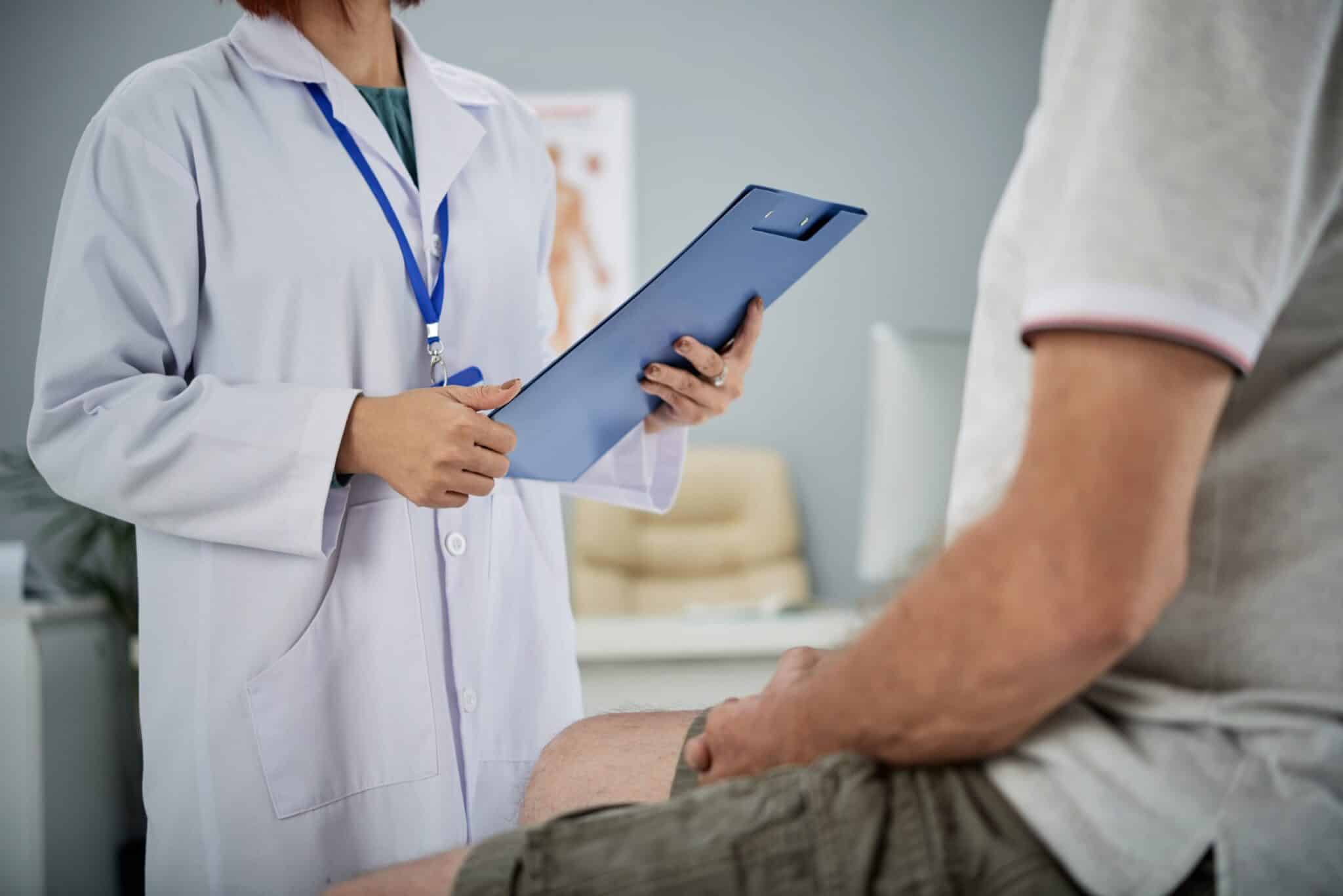 Medical practitioner asking patient questions from the list