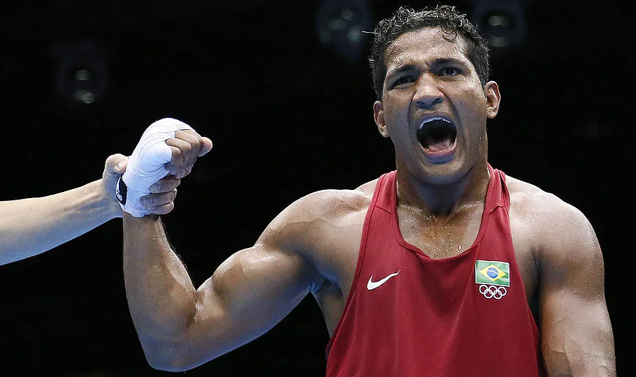 Yamaguchi Falcao Florentino of Brazil is declared winner over Fanlong Meng of China in their round of 16 Light-heavyweight (81kg) match of the London 2012 Olympic Games at the ExCel Arena on August 4, 2012 in London. Florentino was awarded a close points decision victory. AFP PHOTO / Jack GUEZ