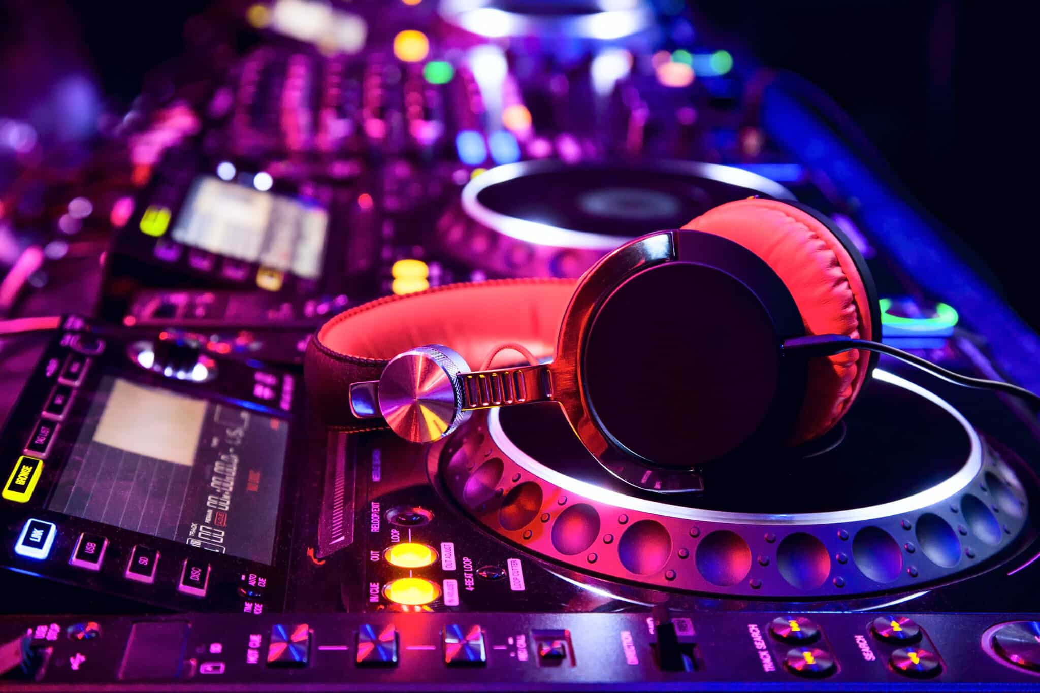 Dj mixer with headphones at nightclub