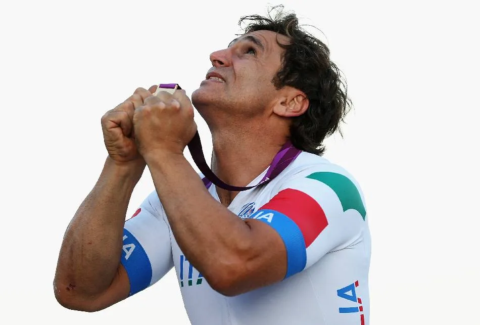 LONGFIELD, ENGLAND – SEPTEMBER 07: Alessandro Zanardi of Italy celebrates with his gold medal after winning the Men’s Individual H4 Road Race on day 9 of the London 2012 Paralympic Games at Brands Hatch on September 7, 2012 in Longfield, England. (Photo by Bryn Lennon/Getty Images)