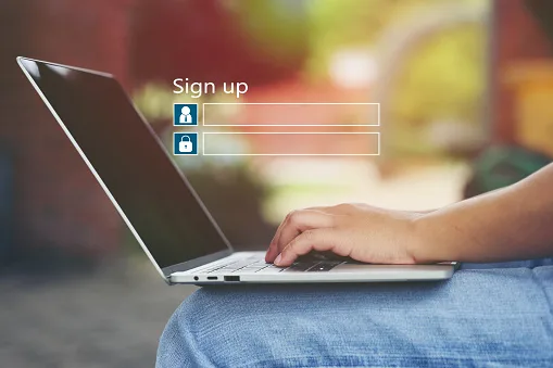 Young woman using laptop computer and sign up or log in username password in coffee shop,GDPR.cyber security and privacy concept