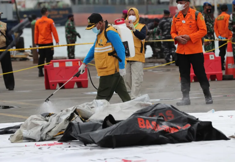 A worker sprays disinfectant at body bags containing human remains recovered from the waters where Sriwijaya Air passenger jet crashed, at Tanjung Priok Port in Jakarta, Indonesia, Sunday, Jan. 10, 2021. Indonesian rescuers pulled out body parts, pieces of clothing and scraps of metal from the Java Sea early Sunday morning, a day after a […]